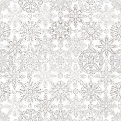A repeating pattern of intricately designed snowflakes, varying in size and style, against a white background.