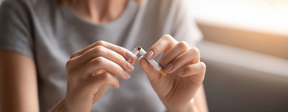 The Cigarette Breaking Gesture Symbolizing Quitting Smoking and Healthy Lifestyle Change