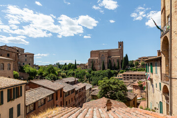 Obraz premium basilica di san domenico in siena tuscany italy seen across rooftops on a sunny day no people