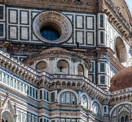 architectural detail of the exterior of florence cathedral and its dome sunny day