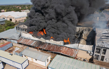 Fototapeta premium Major Industrial Blaze, Huge Factory Fire Incident Highlighting Severe Insurance Risk and Property Destruction,
