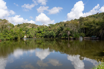 Obraz premium Scenic view of Pugu Hills and its tranquil lake near Dar es Salaam, showcasing Tanzania’s natural beauty and peaceful landscapes.