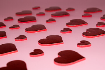 Valentine's day background. Red hearts on pink background.