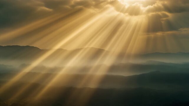 Crepuscular Rays Streaming Through Clouds Over Misty Hills in Dramatic Natural Landscape