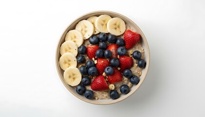 Healthy oatmeal bowl topped with fresh berries and banana slices