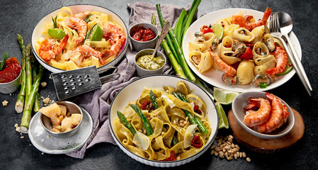 Italian dinner table with assortment of pastas.