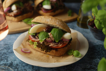 Traditional French sandwiches Pan Bagnat with tuna and salad niсoise	