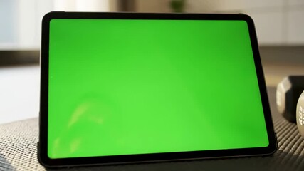 Interactive Health Technology with back view of fitness woman using green screen smart phone at home preparing for workout doing a tap on mobile while resting during training distortion, overlay - Powered by Adobe