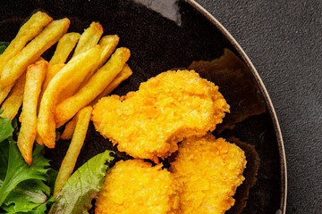 Nuggets and french fries fast food tasty snack fresh delicious gourmet food fonna on the table rustic food top view copy space
