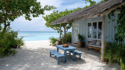 A beach house on a sandy shore, the water is crystal clear and turquoise blue, a wooden bench, fresh fruit, white and blue walls, large windows, a pastel blue table, with a view of the ocean waves.