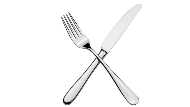 A shiny fork and knife are crossed over each other against a solid black background