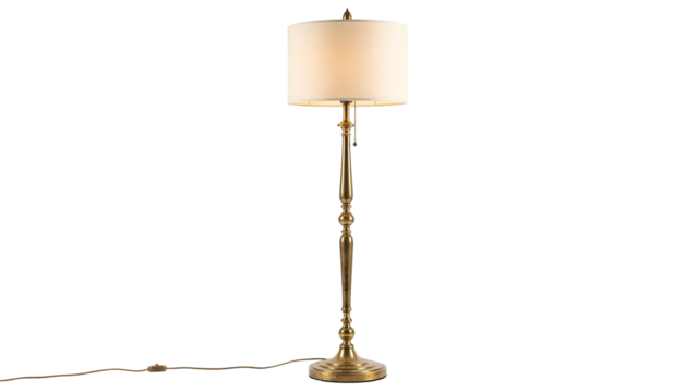 A brass floor lamp with an off-white shade against a black background