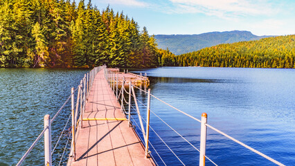 Wooden float-bridge with fishing platform on Sasamat Lake, BC, Canada.