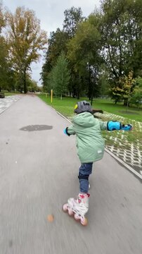 A child boy is roller skating