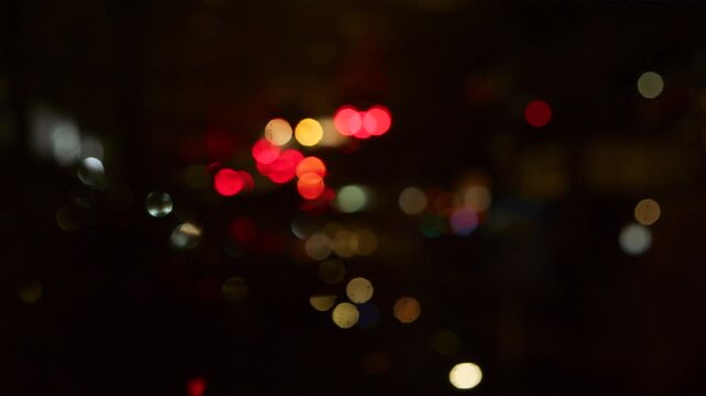 An abstract background with blurred car headlights at night and a soft bokeh effect is perfect for automotive, transportation, and urban design projects.  - Powered by Adobe