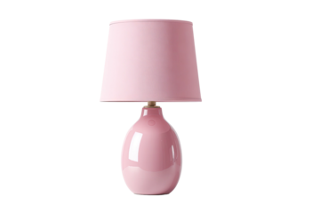 A pastel pink lamp with a rounded base and a matching shade, set against a black background