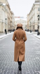 Fototapeta premium Back view of elegant woman in beige coat and beret walking away on snowy cobblestone city street, stylish winter urban fashion lifestyle vertical