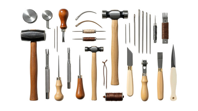 A collection of leatherworking tools laid out against a black background