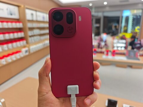 Shanghai,China-Nov.16th 2025: hand hold Oppo Find X9 Pro phone in store