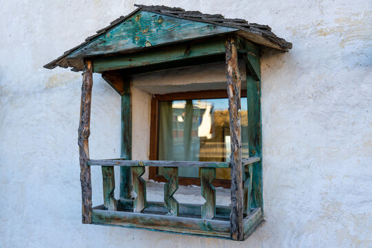 Charming window flower box on a stone wall.