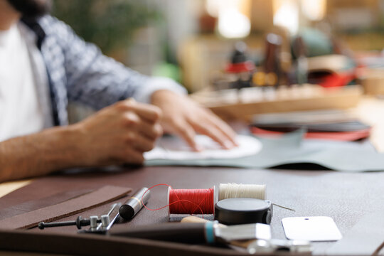 Workshop background tailor shoes maker from skin. Banner shoemaker industry business, Natural leather brown color with tools