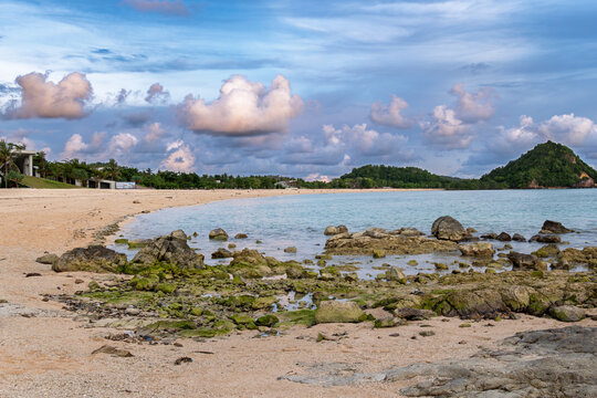 Kuta Lombok Indonesia &ndash; Sunset from sandy shore with clouds and vibrant sky seen from Kuta Beach Mandalika.