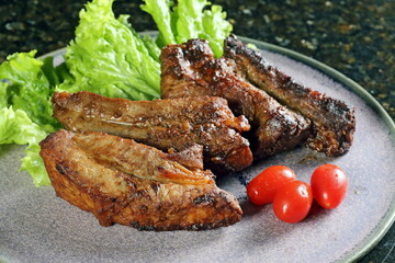 Pork Ribs with Miso: cup of miso, sugar, water, mirin sake, pork ribs, oil, chopped onion, chopped garlic clove, teaspoon of ginger, and chopped scallions.