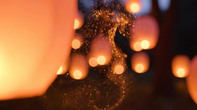 Magical sky lanterns gracefully floating upward create a stunning display of light and celebration perfect for festive events and cultural traditions