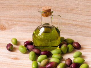 Olive oil. Natural, eco-friendly olive oil in Greece in a glass bottle on the table, rich green color, with fresh olives nearby, elegant and rustic.
