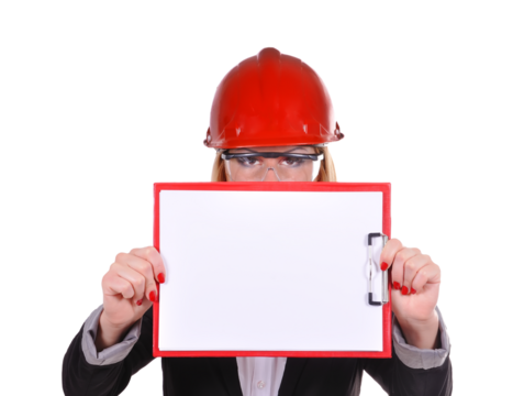 Businesswoman engineer in a red helmet holding a clipboard