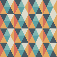 Obraz premium A retro geometric pattern featuring colorful triangles arranged in a seamless tessellation, creating a vintage abstract background.