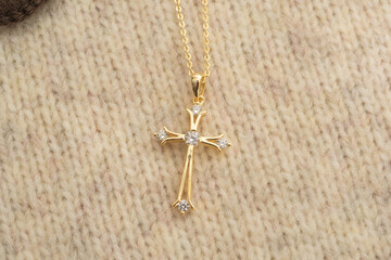 The cross-shaped necklace is a perfectly designed accessory.