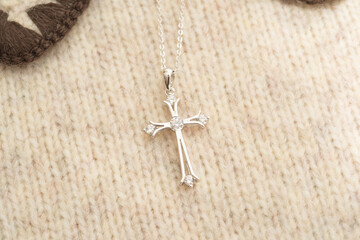 The cross-shaped necklace is a perfectly designed accessory.