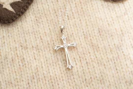 The cross-shaped necklace is a perfectly designed accessory.