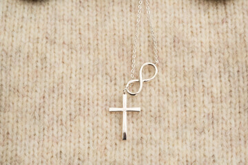 The cross-shaped necklace is a perfectly designed accessory.