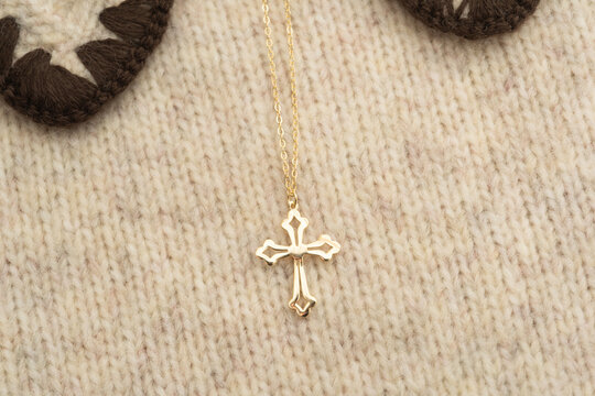 The cross-shaped necklace is a perfectly designed accessory.