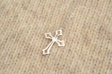The cross-shaped necklace is a perfectly designed accessory.