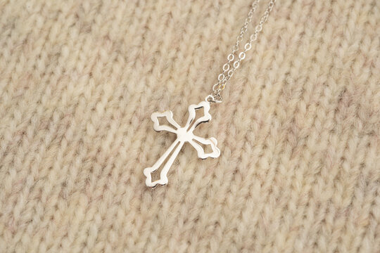The cross-shaped necklace is a perfectly designed accessory.