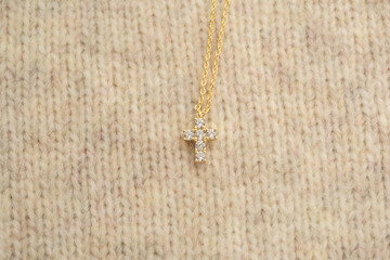 The cross-shaped necklace is a perfectly designed accessory.