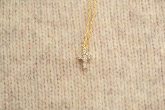 The cross-shaped necklace is a perfectly designed accessory.