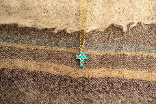 The cross-shaped necklace is a perfectly designed accessory.