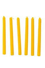 Close-up of yellow candle, isolated on white background.