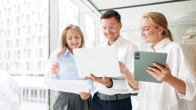 Team collaboration in modern office setting
