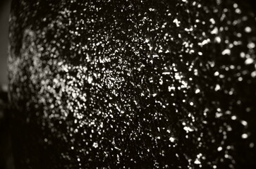 Texture, light, shadow and architecture. Light shower of a wall.