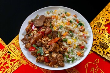 Traditional chicken xadrez with colorful chop suey rice