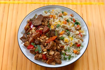Traditional chicken xadrez with colorful chop suey rice