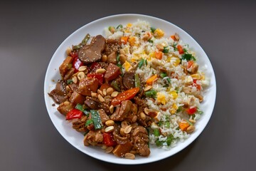 Traditional chicken xadrez with colorful chop suey rice