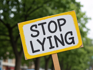 Bold 'Stop Lying' protest sign demands truth and integrity at rally, perfect for news, activism, and social justice campaigns needing impactful visuals