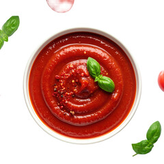 Tomato sauce with basil leaves and red pepper flakes in a white bowl, aerial view, with tomato and basil garnish. studio shot on white