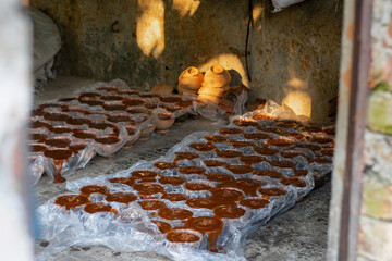 Rustic Industry: Early Morning Sun on the Jaggery Production Floor